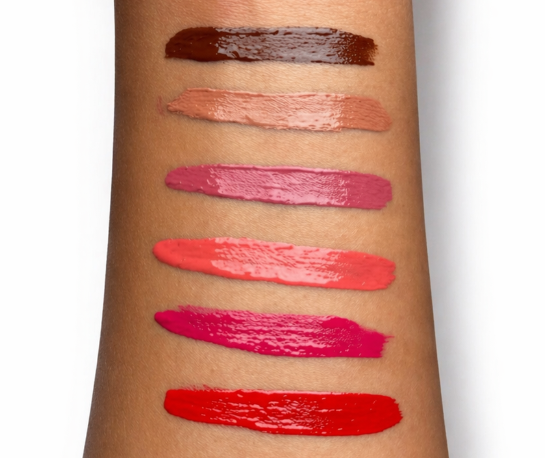 Lipstick swatches on a person's arm with a white background